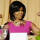 First Lady Michelle Obama flexes her famous "guns."